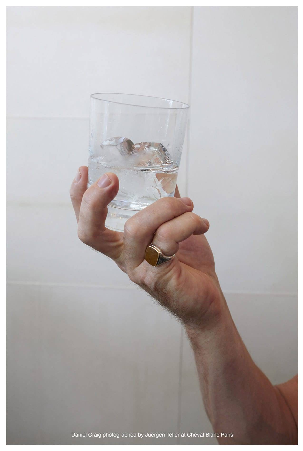 Daniel Craig holding a glass