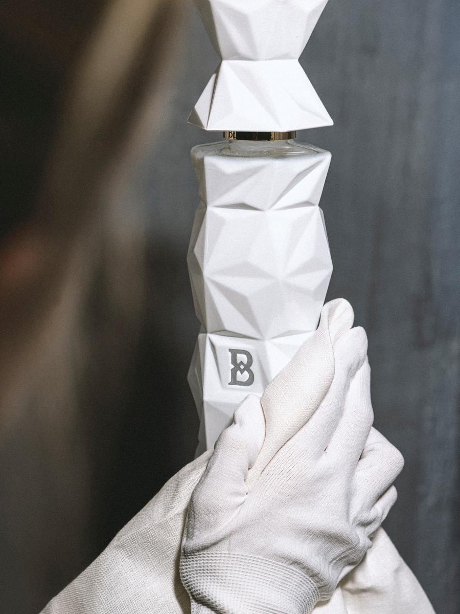 Belvedere 10 bottle held by gloved hands