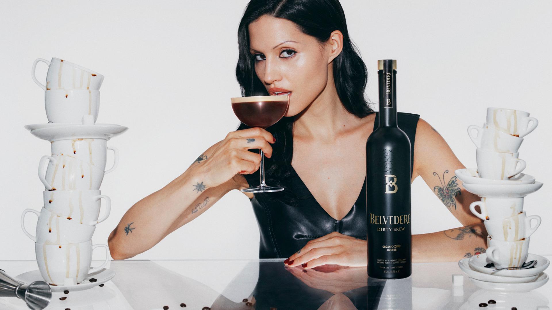 Gabbriette in a black top with a Dirty Espresso Martini, close-up