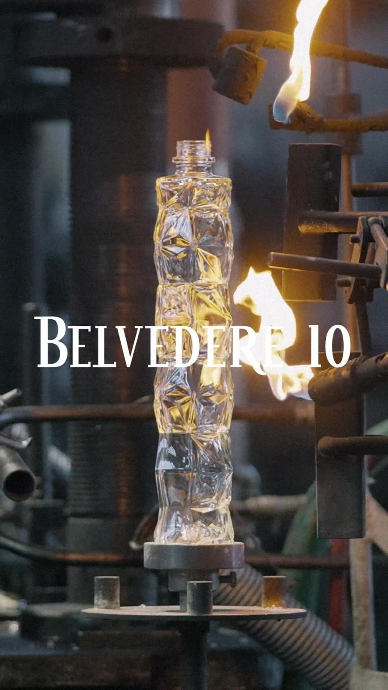 A sculpted Belvedere bottle turned in the flame at the glassworks