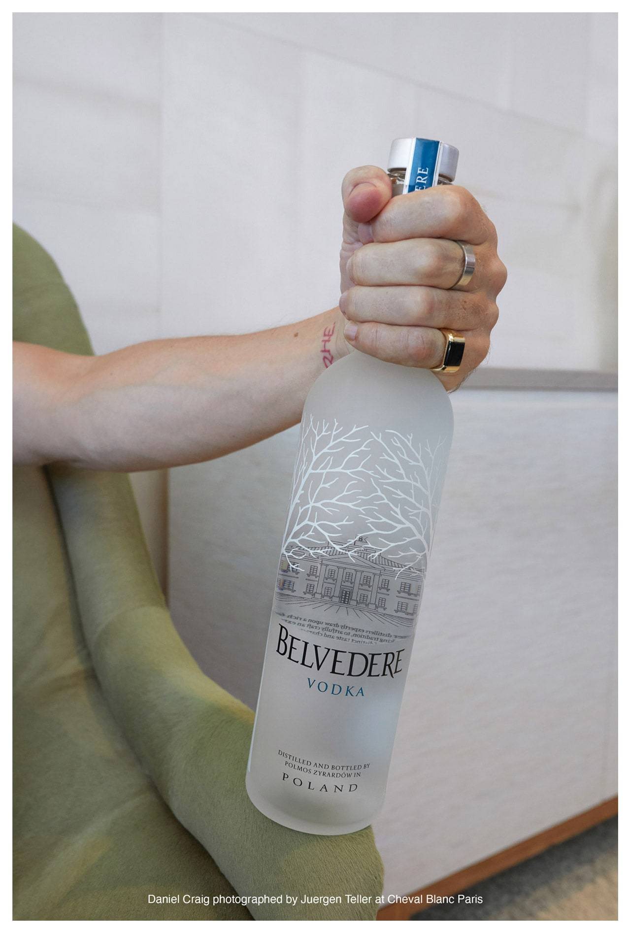 Daniel Craig holding a bottle of Belvedere
