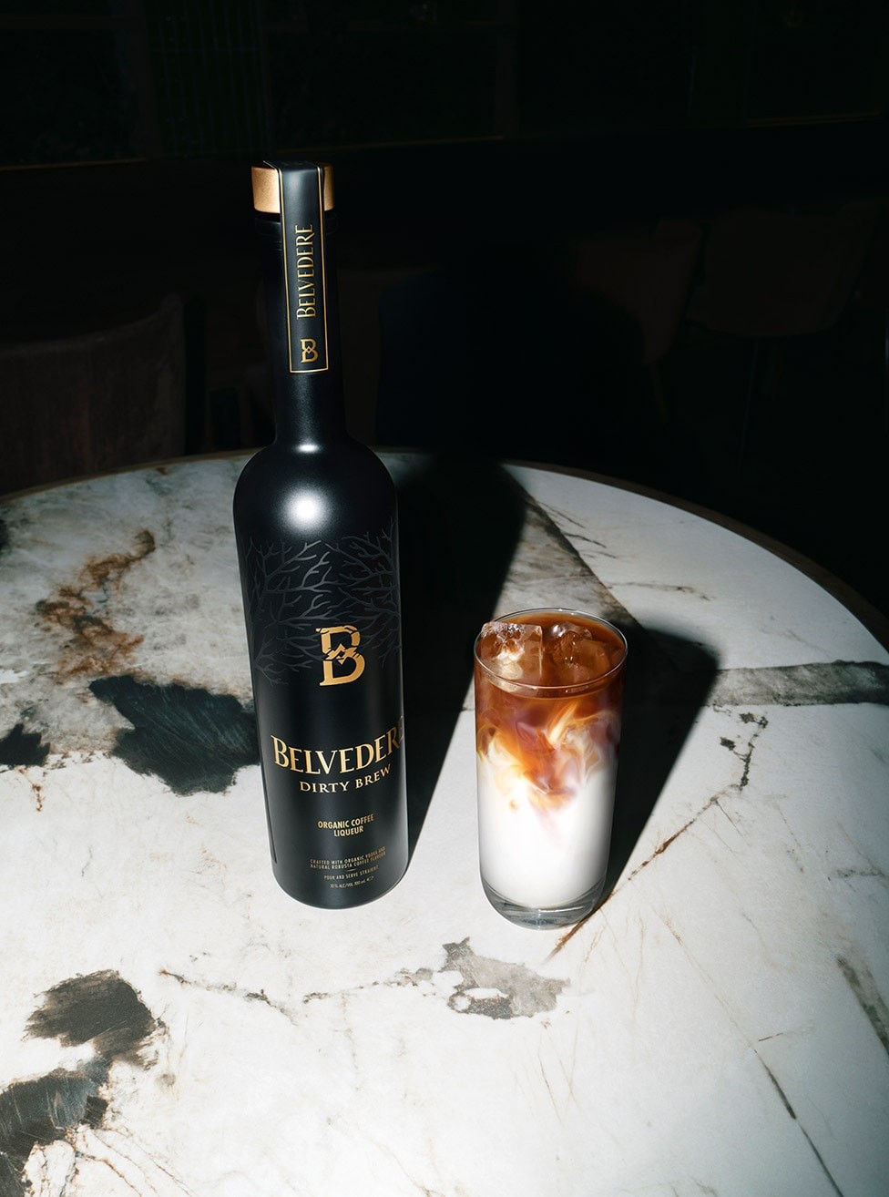 Dirty Brew bottle with a Dirty latte cocktail on a table